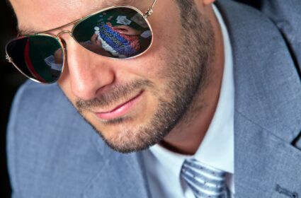 man wearing poker glasses