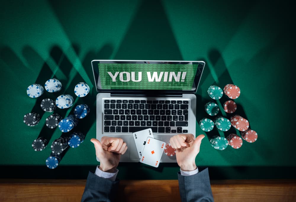 laptop showing a poker player winning